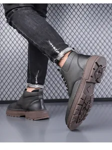 Detailed side profile of men's winter boots featuring thick non-slip rubber soles