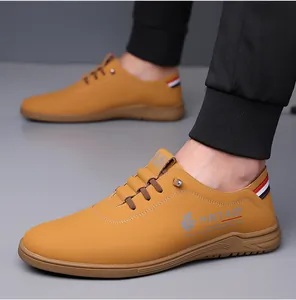 Detail view of ginger men's leather shoes with side print and stylish tricolor heel strap