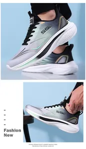 Detail view of breathable grey mesh sneaker with green accents and thick EVA foam sole