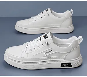 Detailed side view of white low-top casual sneakers with elegant ONESHADE lettering print