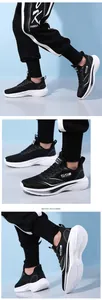 Detailed close-up showing breathable mesh and cushioned sole of black and white sneakers