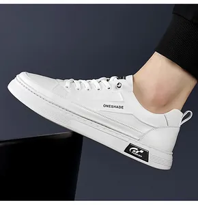 Detail view of white leather low-top casual sneakers with ONESHADE lettering