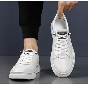 Close-up of white leather casual sneaker featuring STORY logo and thick striped rubber sole