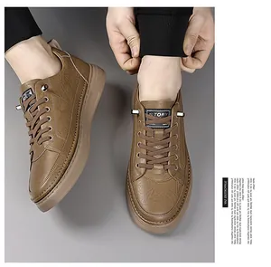 Macro detail of men's brown casual shoes featuring unique leaf-textured embossed leather