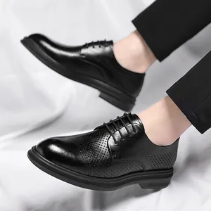 Men's black hollow business dress shoes with brogue style and breathable cutout design