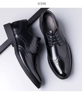 Detail of black leather Brogue shoes showing intricate perforated wingtip carvings