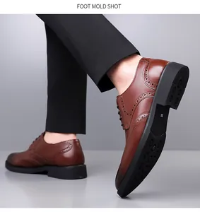Detail showing the brown brogue carving pattern and anti-slip rubber sole of men shoe
