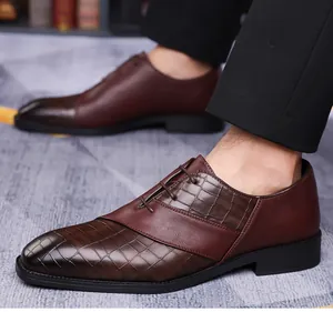 Macro view of men's leather dress shoe with crocodile texture and matte finish