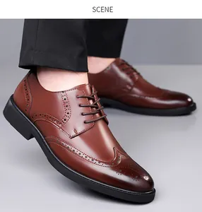 Detailed close-up of brown brogue leather shoes with classic wingtip carving details