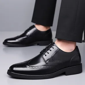 Black leather brogue formal dress shoes for men with classic wingtip carving details