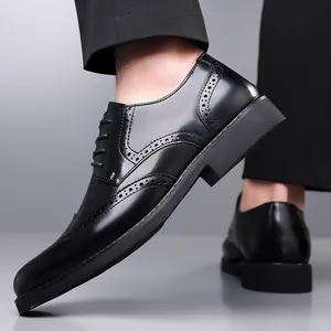 Polished black Brogue dress shoes with classic wingtip perforated details for men