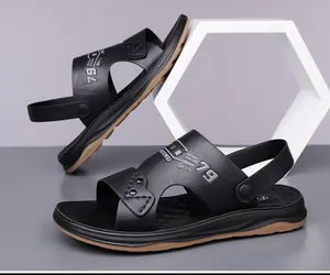 Detail of black leather men sandals featuring adjustable heel strap and anti-slip sole