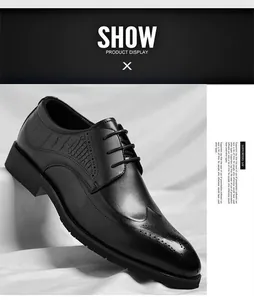 Close-up of black leather brogue shoes with wingtip carving and embossed texture detail