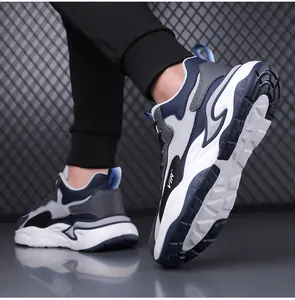 Detailed close-up of thick non-slip sole and mesh design on men's athletic sneaker