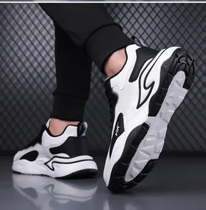 Dynamic view of breathable black and white mesh athletic shoes with thick anti-slip soles