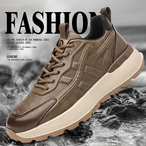 Men's retro chunky sneakers in brown mixed materials with thick sole on outdoor rocks