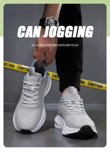 Close-up of breathable grey mesh fabric and white cushioned sole of the men running shoes