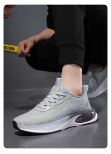 Detailed view of light gray breathable mesh sneakers with vibrant cushioned thick sole