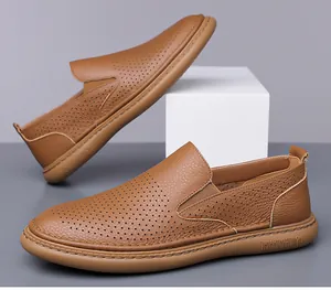 Close-up of brown leather loafers with breathable perforated upper and thick rubber sole