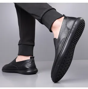 Detailed view of men's black breathable leather slip-on loafers with durable non-slip sole