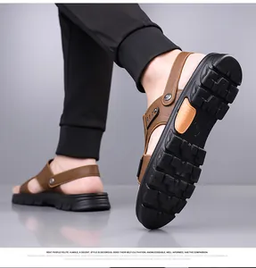 Detail of non-slip rubber sole and brown leather upper on men's outdoor beach sandals