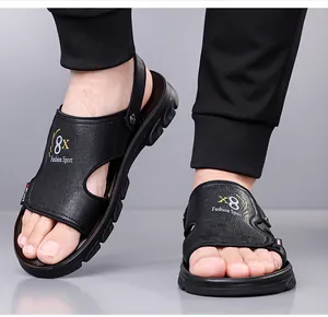 Detail of men's black sport sandals showing soft latex sole and faux leather texture