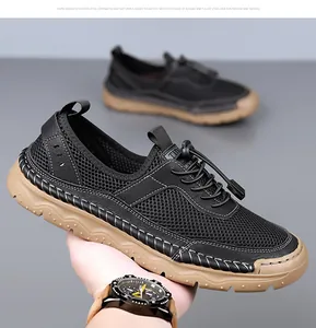 Détail de basket en mesh noir pour homme avec coutures à la main et semelle en gomme