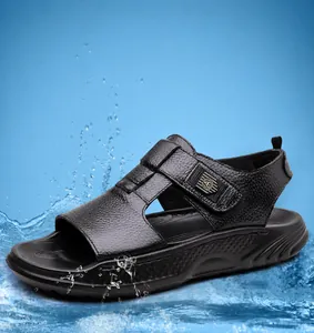 Close-up of black leather men's sport sandals with velcro strap and waterproof sole