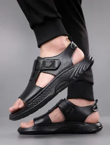 Macro detail of men's black leather sandals with textured upper and thick anti-slip sole