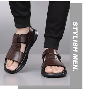 Close-up of men's brown leather sandals featuring adjustable velcro straps and non-slip soles