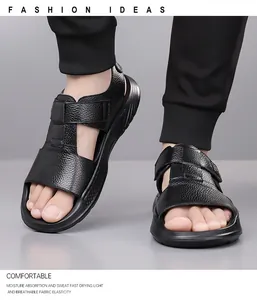 Detail of black leather men's sandals with velcro straps and thick anti-slip sole