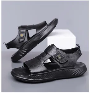 Macro detail of men's black leather sandal with textured strap and anti-slip sole