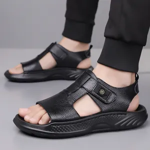 Men's black leather gladiator sandals with platform soles and velcro straps on feet