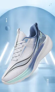 Detail of lightweight breathable white mesh sneakers with gradient cushioned sole