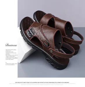 Detail view of premium brown cowhide leather texture and buckle on mens dual-use sandals
