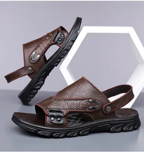Close-up of brown leather men's dual-use sandals with detailed texture and metallic buckle