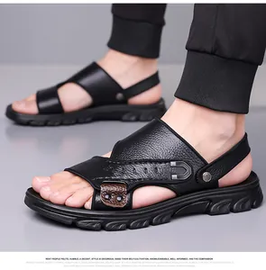 Close-up of black cowhide leather sandals featuring metal buckle and textured non-slip sole