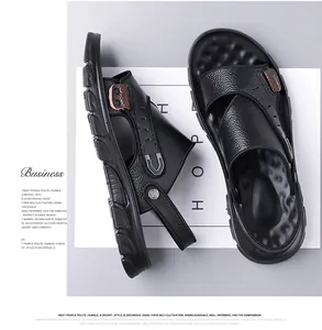 Detail view of premium black leather sandals with cross straps and adjustable heel strap