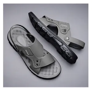 Close-up of flexible gray strap and non-slip sole of versatile men's beach sandals