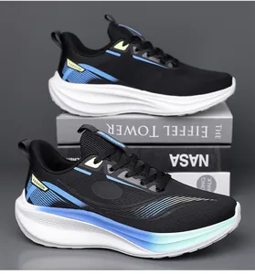 Detail of breathable mesh upper and gradient sole on lightweight black running shoes