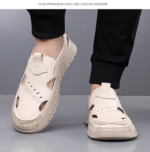 Detail of men's beige leather hollowed sandals featuring white hand-stitched seams