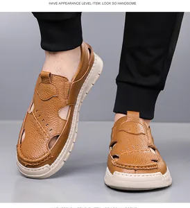Close-up of brown leather men's sandals with breathable cutouts and hand-stitched details