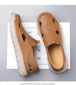Close-up of brown leather hollow-out sandals with lychee grain texture and thick white sole