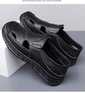 Detail of black leather men's sandals with breathable cut-outs and white stitching
