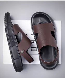 Detailed macro view of dark brown pebbled leather texture and dual-use men's sandal soles