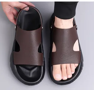 Detail of dark brown leather beach sandal showing the adjustable heel strap for dual-wear use