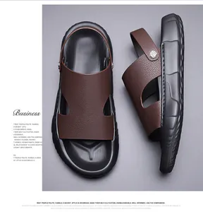 Detail of dark brown leather texture and metal rivets on men's beach sandals