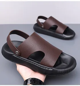 Macro detail of men's leather sandals showing litchi texture and 2-way strap design