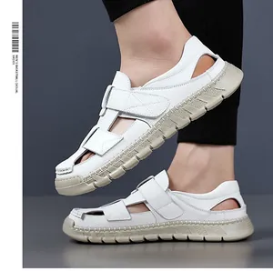 Detail of white litchi leather upper with breathable side cutouts and velcro closure