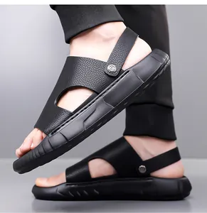 Detailed side view of black leather dual-use sandals showing the thick non-slip sole texture